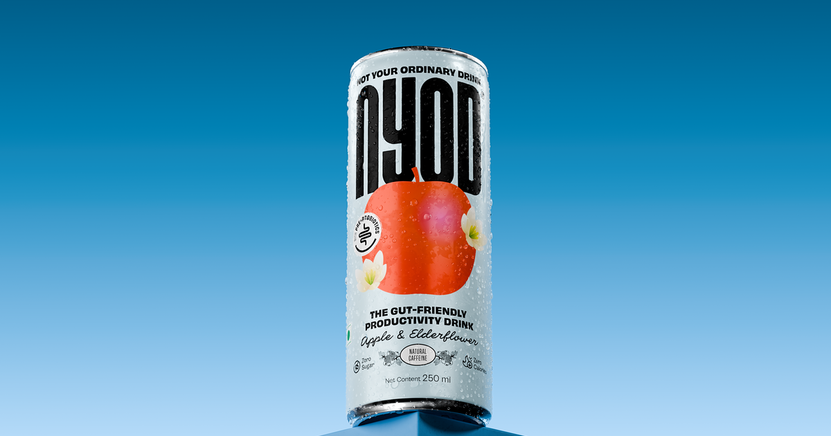 Can of NYOD Apple & Elderflower, a synbiotic drink with pre + probiotics, against a blue sky